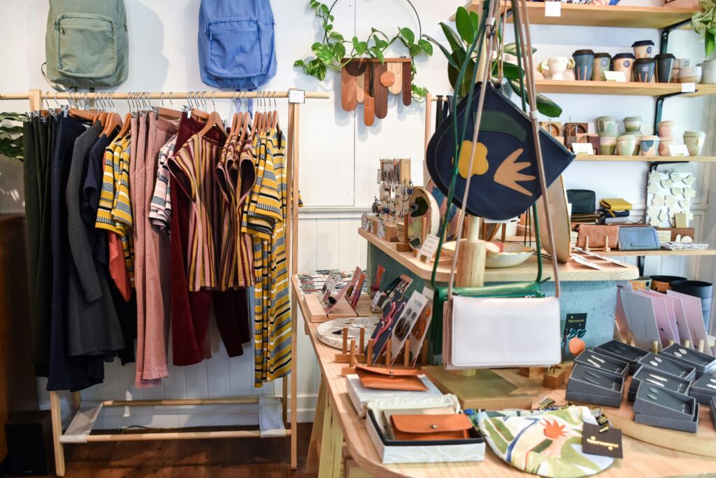 A small business that is a boutique store with displays full of bojo style clothes